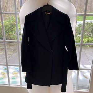 Trina Turk black mid length coat with belt, size 4. In excellent condition.